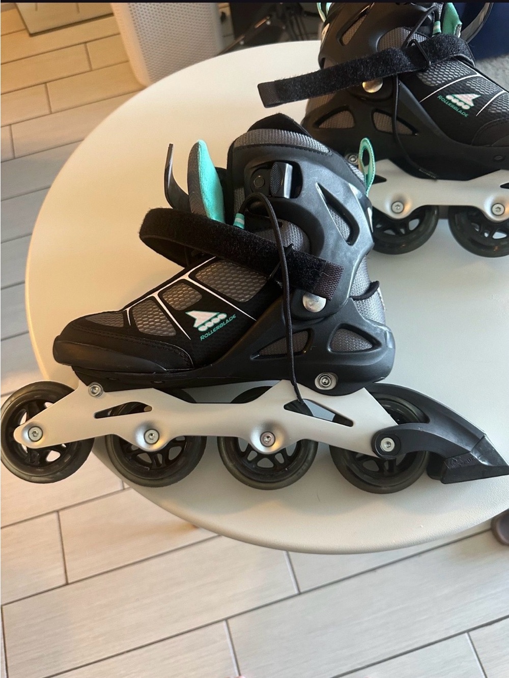 Women’s black and teal Macroblade roller blades size 7